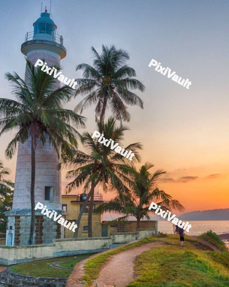 White lighthouse with sunset